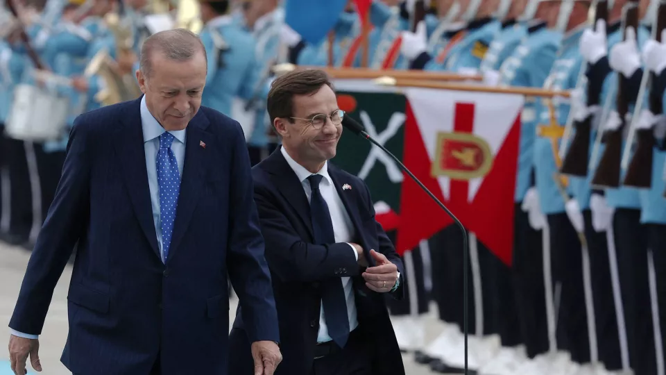 A photo of Erdogan and Kristersson walking side by side