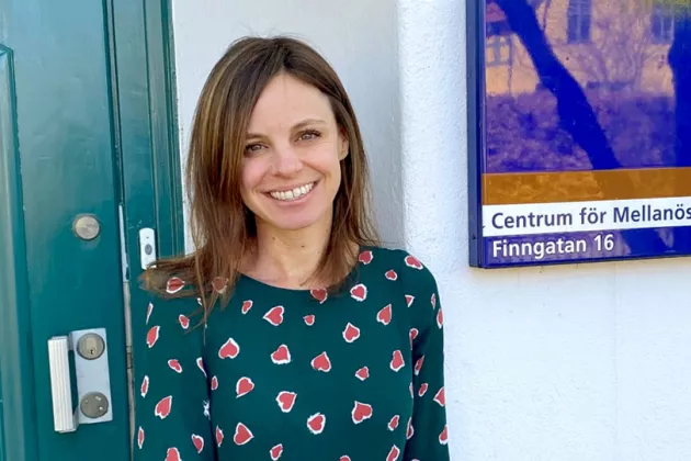 Photo of Sarah Anne Rennick in front of the CMES building