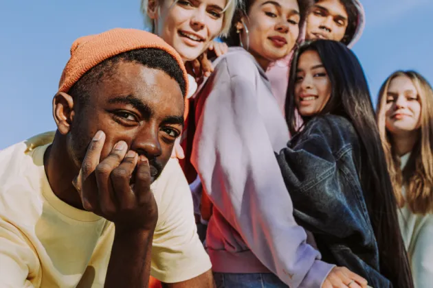A photo of six young people with different ethnicities.