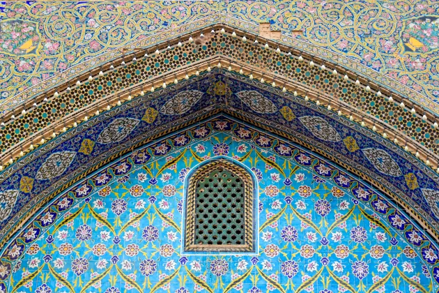 Mosaic front of a shrine with blue and gold colors