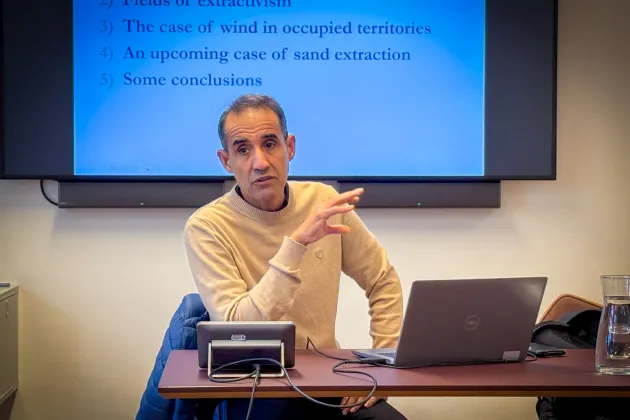 Yahia Mahmoud sitting at a desk talking