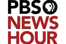 The logo of PBS News Hour