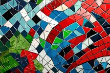 Mosaic of red, black, green, white and blue squares.